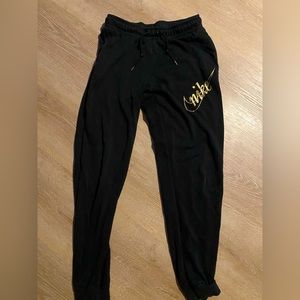 Nike joggers with gold accent